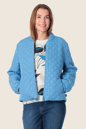 Blaue Steppjacke mit Rundquiltmuster